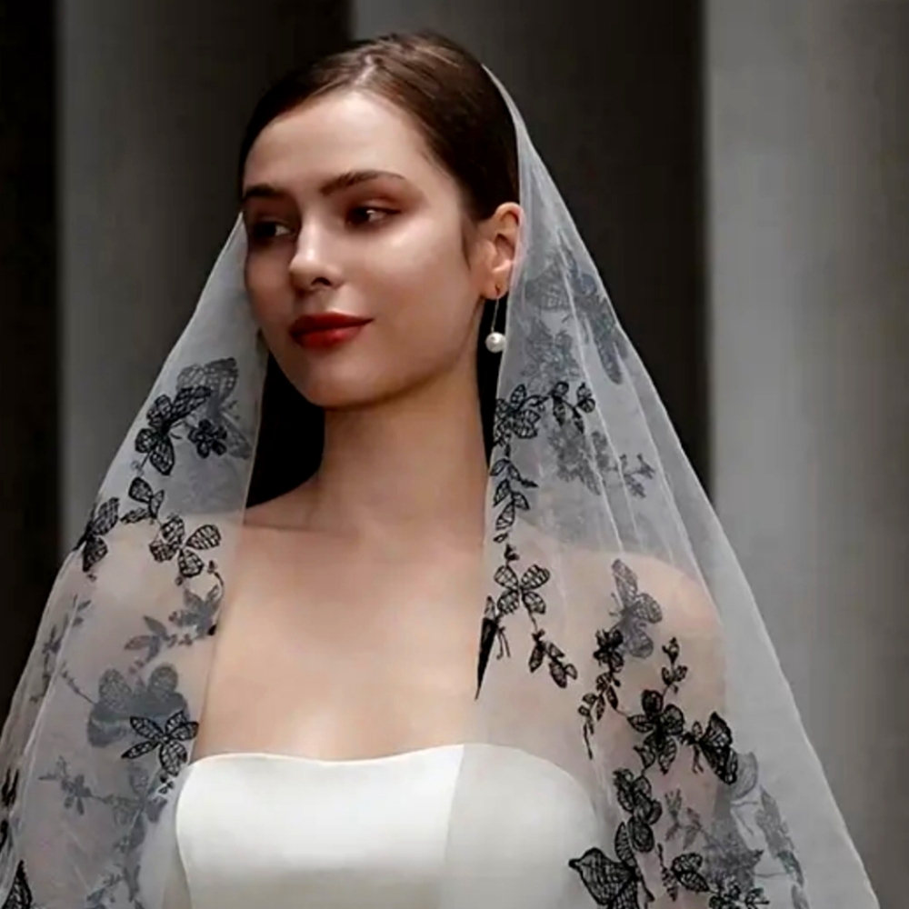 Creamy two tiered black butterfly veil